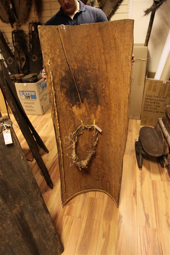 Two Sepik River tree bark shields, hardwood shield & board